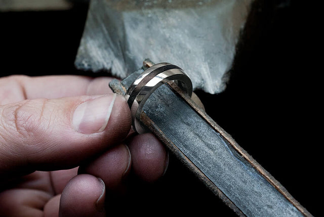 A workshop picture of the Thames Geo ring being sanded in the workshop.